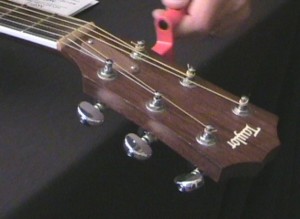 Lower the E string with the guitar tuner